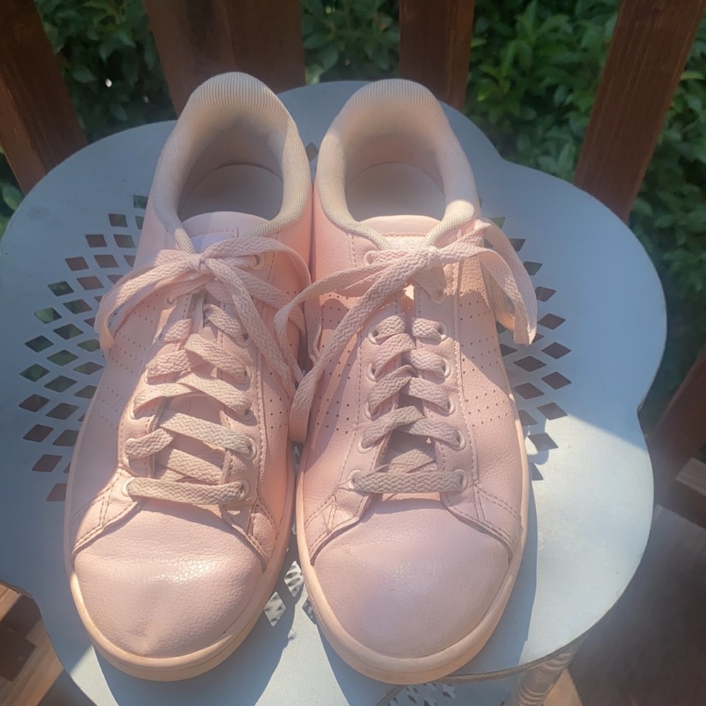 Pink women’s Adidas with white stitching